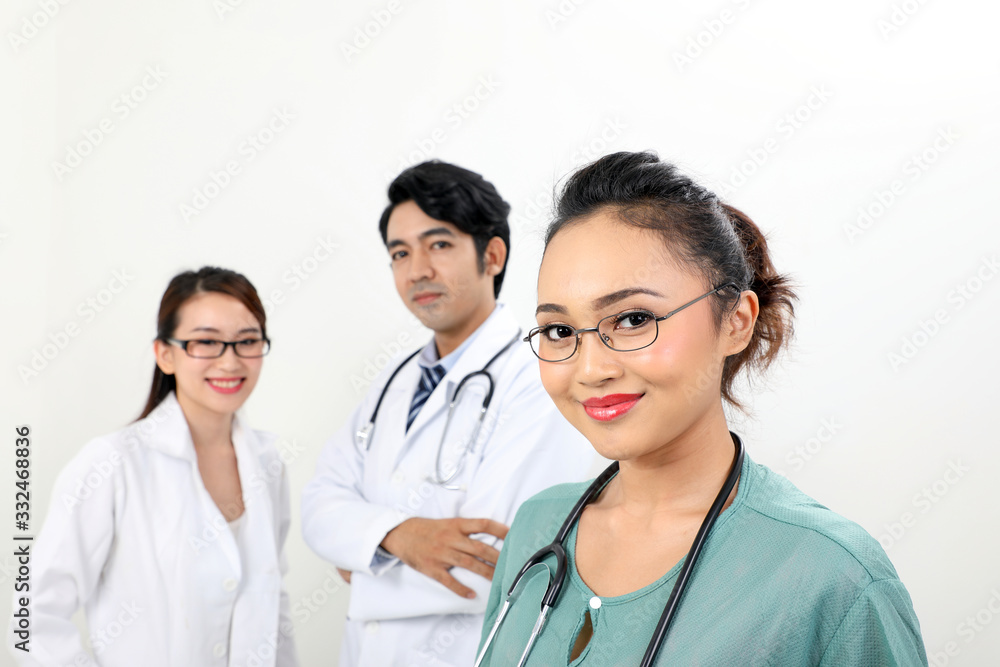 Young asian malay chinese male female doctor on white background smile confident looking at camera Young asian malay chinese male female doctor on white background smile confident looking at camera