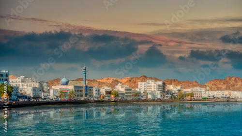 Waterfront of Muscat, Oman reflected in the water