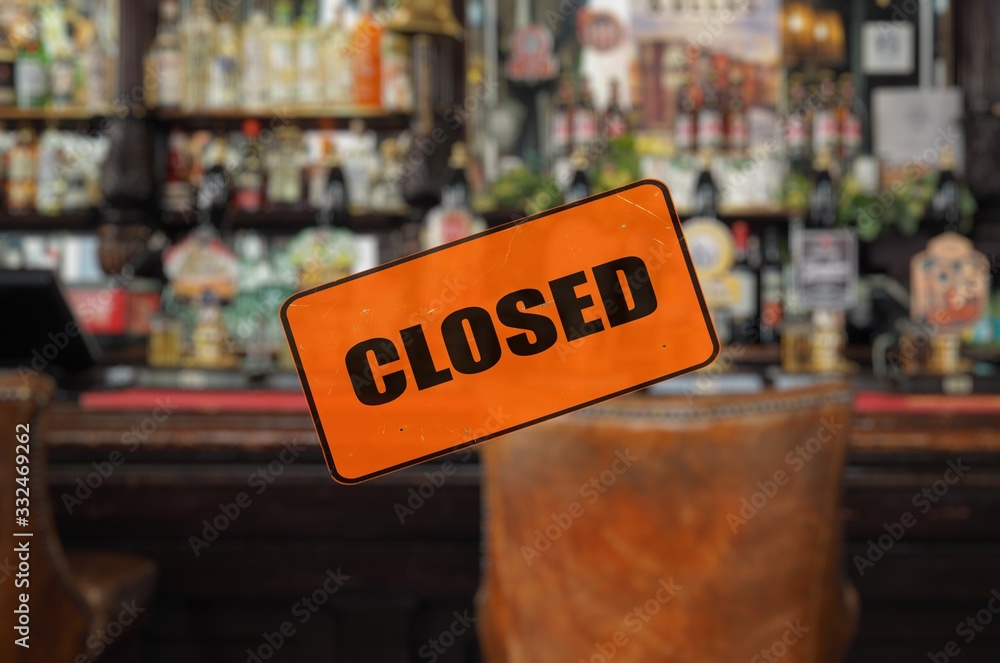 Empty pub with closed sign