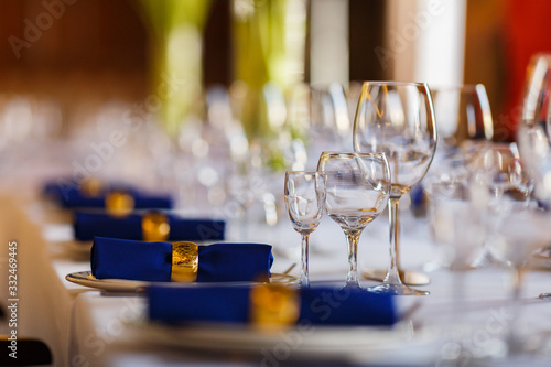 Wine glasses and champagne flutes on table, Wedding decor. Selective focus