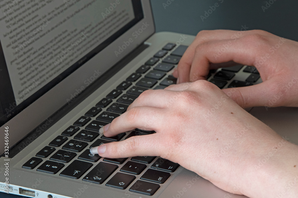 hands typing on laptop keyboard hands typing on laptop keyboard