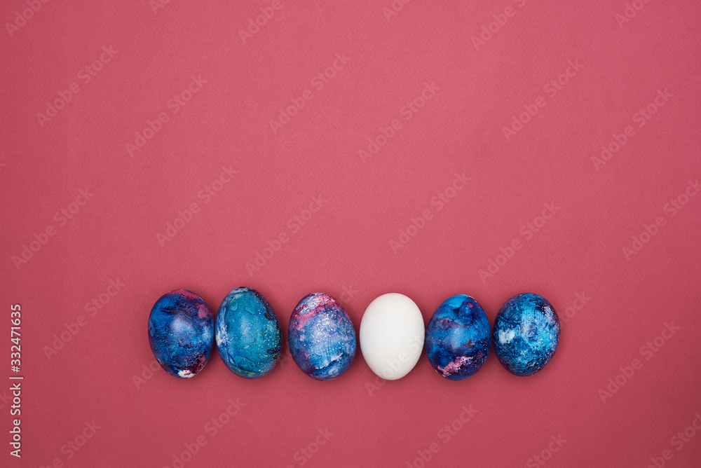 Easter eggs painted blue. Burgundy background. Easter eggs painted blue. Burgundy background.