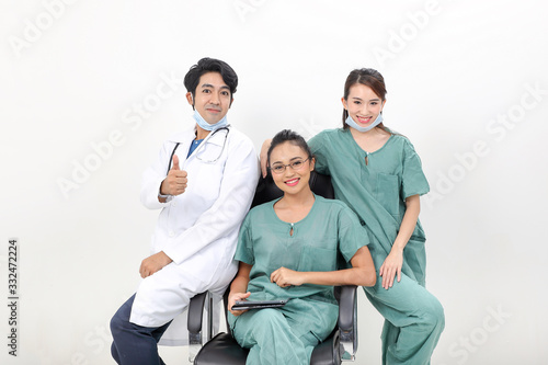 Young asian malay chinese male female doctor sit on chair stand talk discuss research pad technology thumbs up