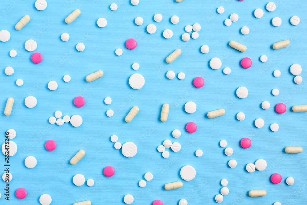 Assorted pharmaceutical medicine pills, tablets and capsules. medical pattern on a blue background. top view, flat lay Assorted pharmaceutical medicine pills, tablets and capsules. medical pattern on a blue background. top view, flat lay