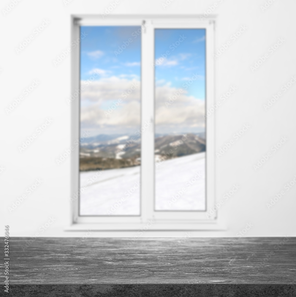 Naklejka premium Empty stone table and window with beautiful view indoors