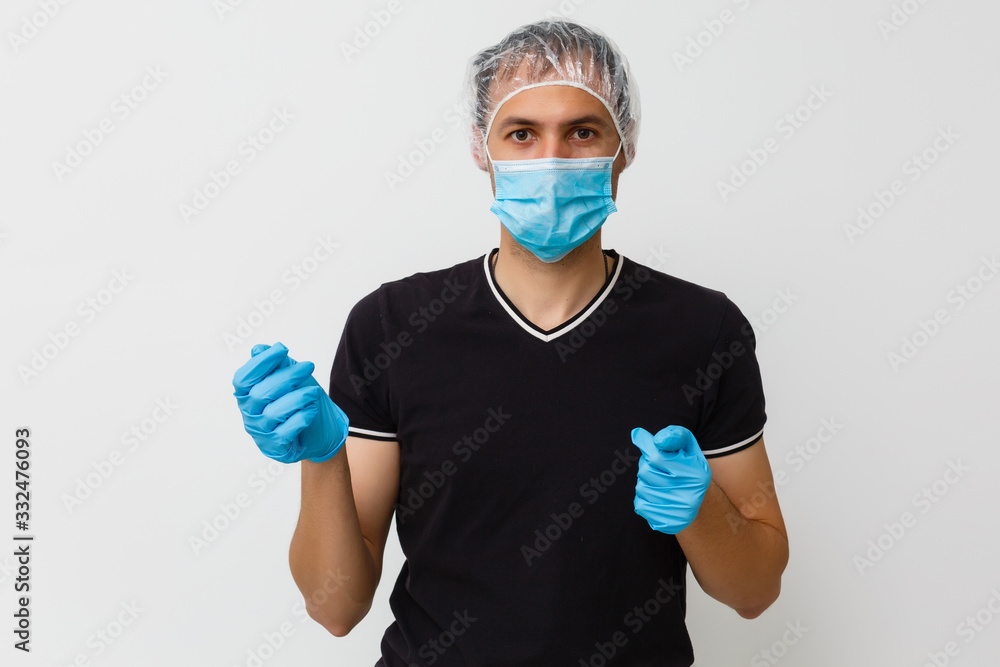 © Angelov - Portrait of Handsome Indian/Asian Young man wearing Medical Health Mask, isolated over white background