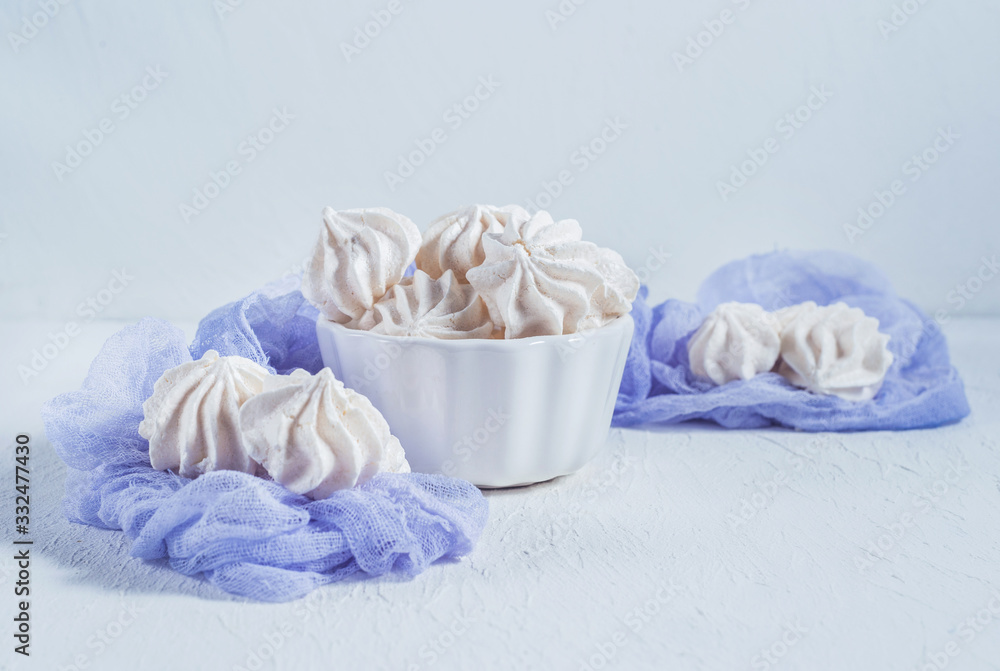 white meringues on a white background white meringues on a white background