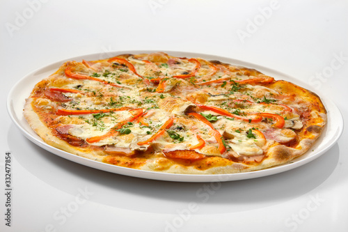 Flatlay of Italian pizza on wooden background. Rustic homemade pizzas with salami, bacon, cheese, eggs and raw vegetables on shabby wooden background. Healthy vegetarian fungi pizza