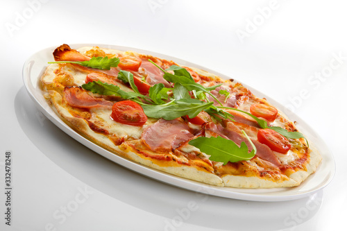 Flatlay of Italian pizza on wooden background. Rustic homemade pizzas with salami, bacon, cheese, eggs and raw vegetables on shabby wooden background. Healthy vegetarian fungi pizza