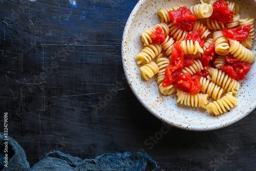 pasta rotini tomato sauce (vegetarian dish, Italian cuisine) menu concept. background. top view. copy space for text