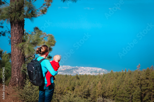mother and little baby travel in mountains