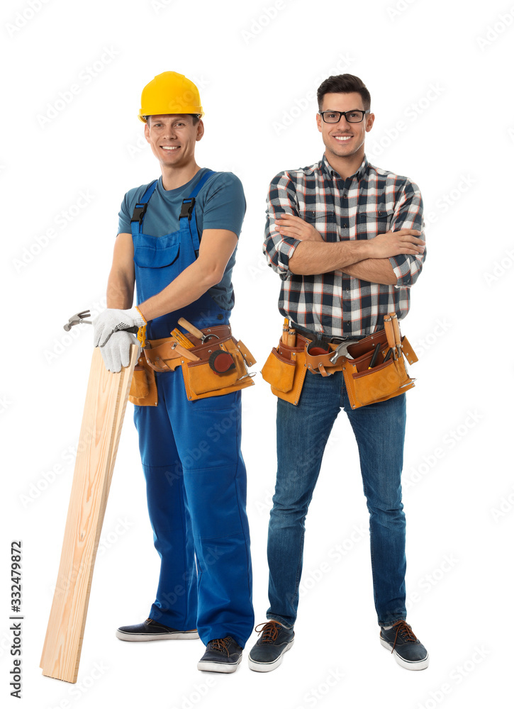 Handsome carpenters on white background. Professional workers Handsome carpenters on white background. Professional workers