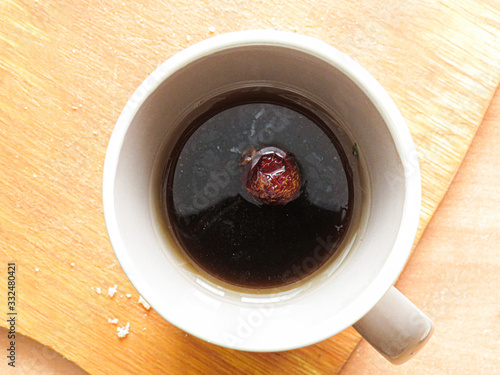 cup of coffee on wooden background