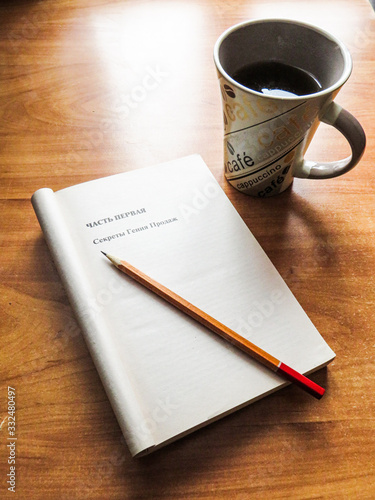 cup of coffee and notebook on a table