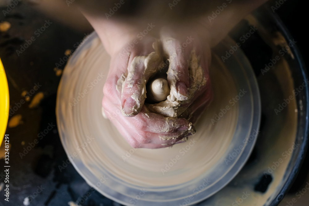 Fototapeta premium The master works behind the potter's wheel