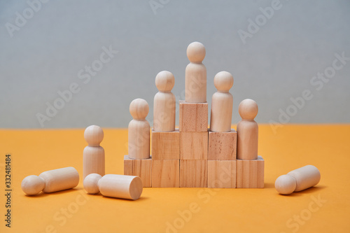 Career success mockup. Reach goal, winning. Professional growth, motivation. Wooden people figures on pyramid of cubes