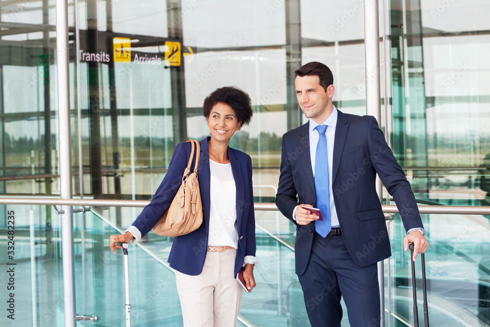 Businessman and businesswoman at airport. Businessman and businesswoman at airport.