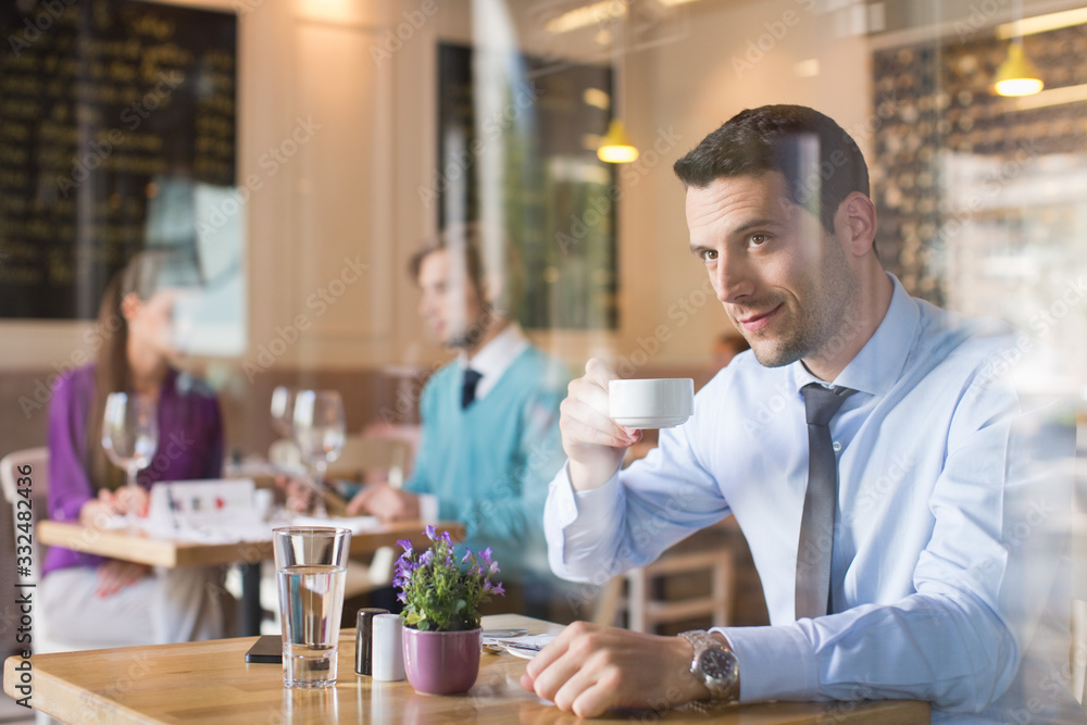 Man drinking tea in restaurant. Man drinking tea in restaurant.