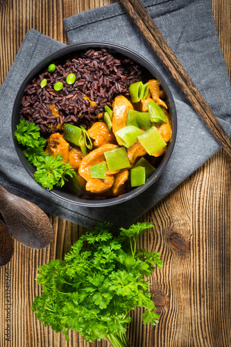 Thai red curry with chicken and black rice.