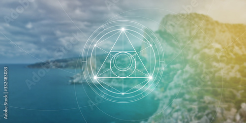 Philosopher stone sacred geometry spiritual new age futuristic illustration with transmutation interlocking circles, triangles and glowing particles in front of blurred background.