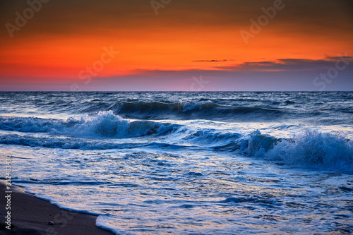 Sea waves and Beautiful dawn sunrise at sea. Seascape.