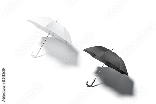 Blank black and white open umbrella mockup lying, top view photo