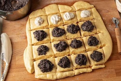 Preparation of buchty - traditional Czech sweet buns made of yeast dough - filling with ground poppy seeds or curd photo