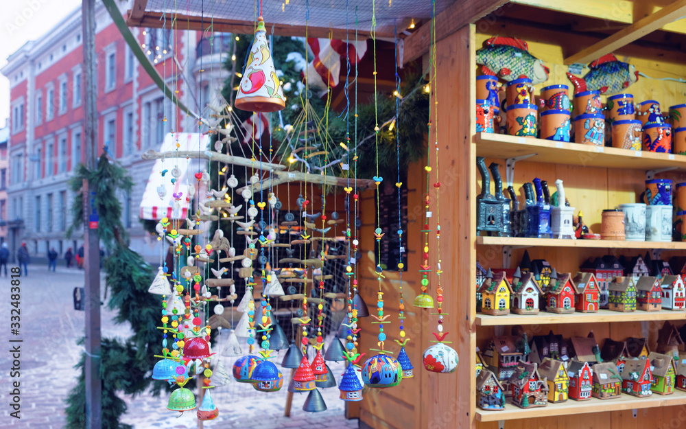 Fototapeta premium Clayware and other traditional souvenirs displayed for sale at the Christmas market reflex