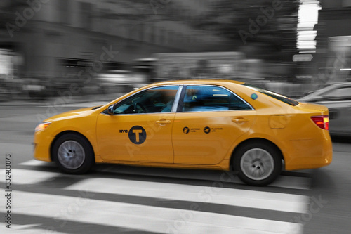 Yellow cab, New York wih motion blur mixed colour and black and white