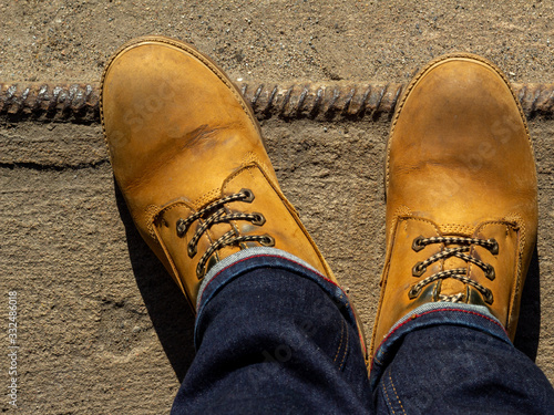 Yellow boots on concrete