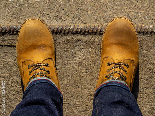 Yellow boots on concrete