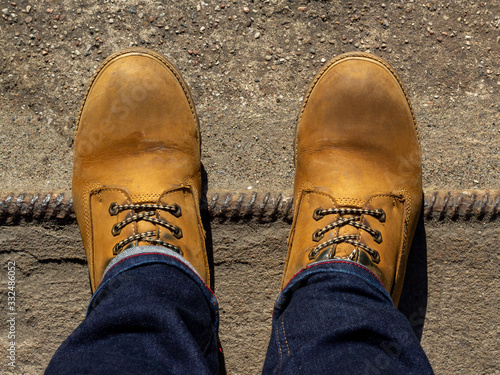 Yellow boots on concrete