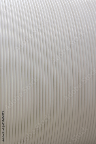 Close-up of ablazed white corrugated plastic surface