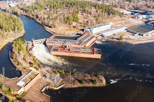 Aerial view of hydroelectric power generation plant and Ankkapurha Industrial Museum at Kymijoki river, Finland.