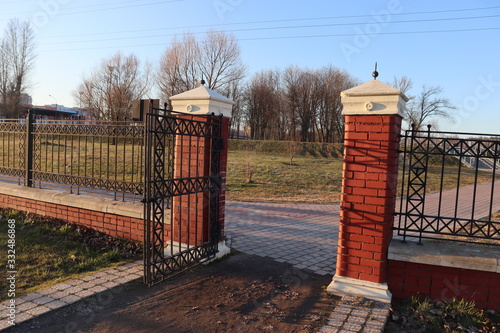 park gate entrance with rustic metal door