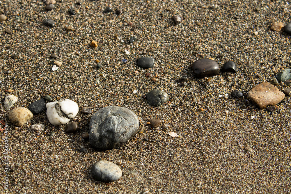 Scattered rocks on sand Scattered rocks on sand