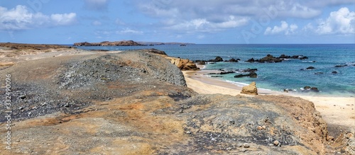 Small cliff overlooking the white sand beach in Djeu, part of the Archipelago of Cabo Verde