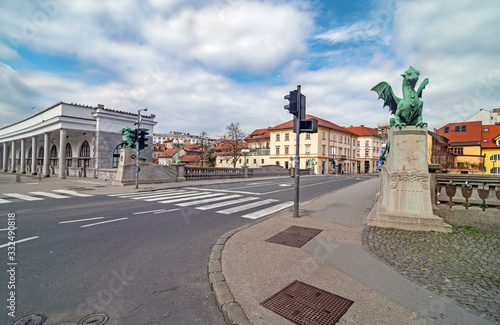 Empty streets on Ljubljana's Dragon bridge on spring Sunday morning, usually packed with people, due to coronavirus quarantine, Ljubljana, Slovenia photo