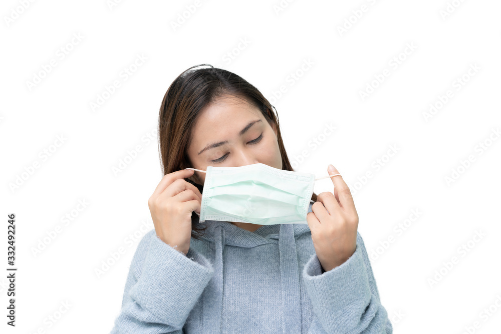 Girl looking at mask again flu and covid-19,corona virus Girl looking at mask again flu and covid-19,corona virus