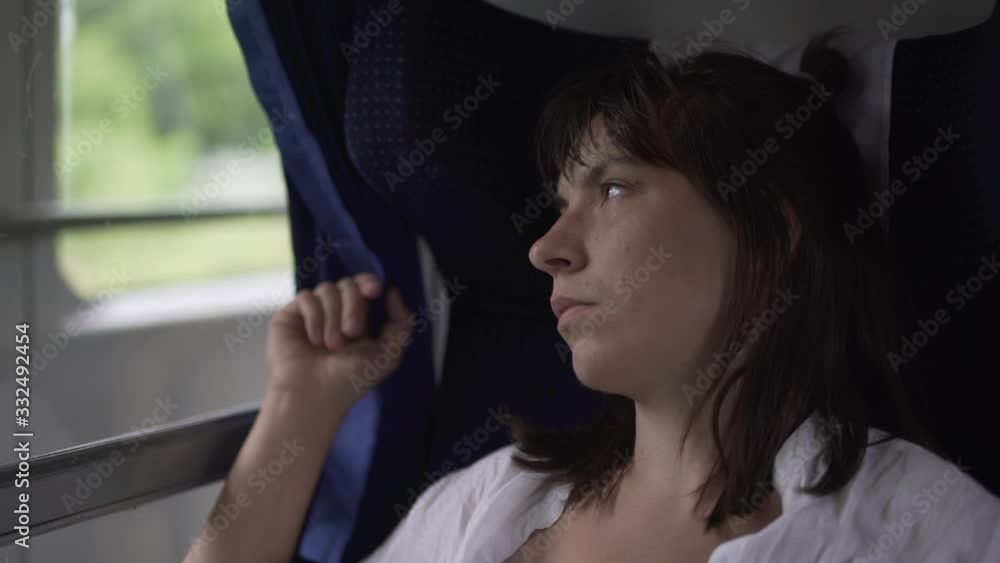 melancholic woman riding the train with a sad look. routine melancholic woman riding the train with a sad look. routine