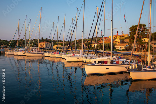 KASTOS island, GREECE-August,2019: Port of Kastos island with moored sailboats - Ionian sea, Greece in summer.