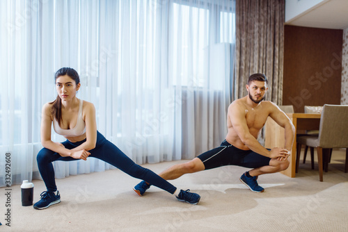 Morning aerobic workout of love couple at home