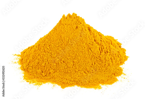 Turmeric powder pile isolated on a white background. Curcuma.