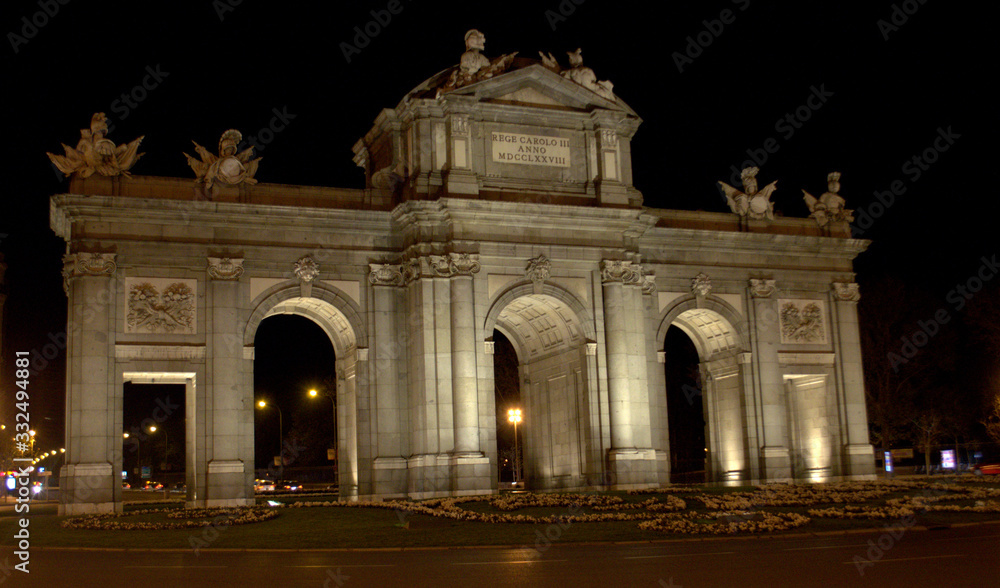 Fototapeta premium Alcalá Door at night. Icon of Madrid city center.