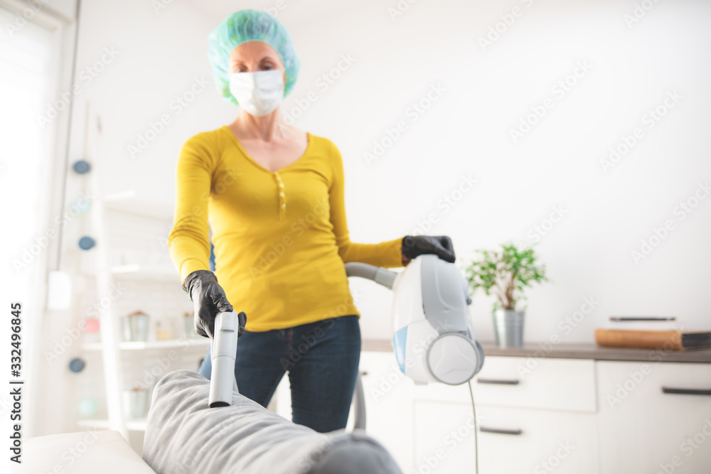 Home, apartment and room sterilization, cleaning, vacuuming with vacuum cleaner in the time of dangerous viruses. Home, apartment and room sterilization, cleaning, vacuuming with vacuum cleaner in the time of dangerous viruses.