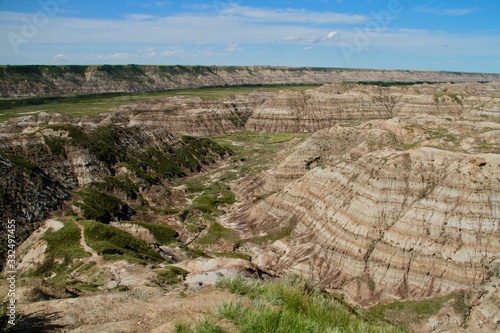 Drumheller Valley on a sunny, bright day.  This is where many dinosaur remains have been found. photo