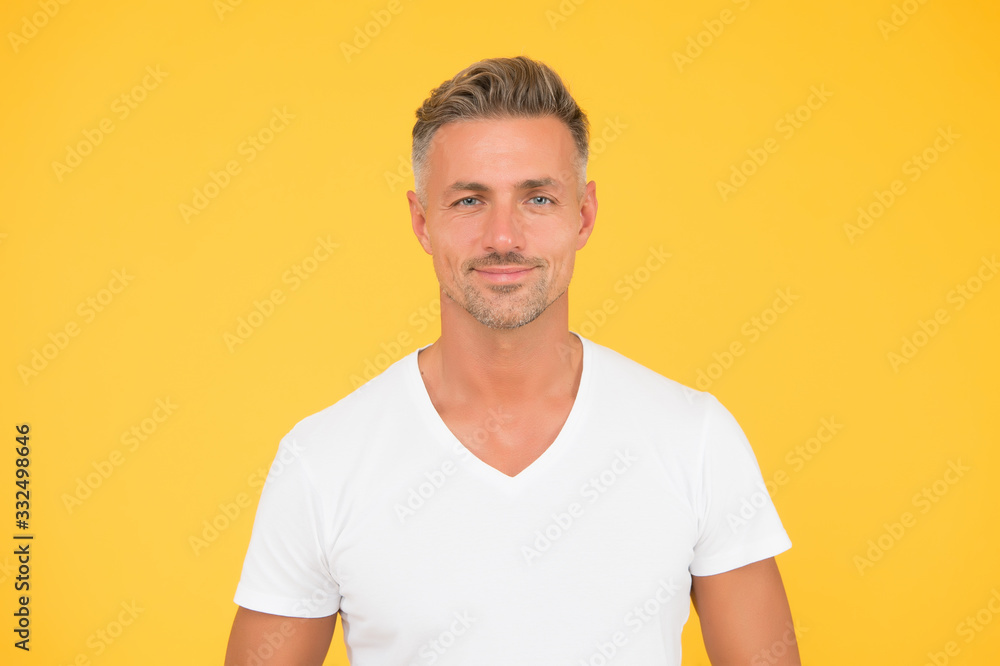 Good looking man. Man yellow background. Unshaven man with stubble beard and haircut. Mens grooming. Barbershop. Handsome man in casual style. Fashion and style Good looking man. Man yellow background. Unshaven man with stubble beard and haircut. Mens grooming. Barbershop. Handsome man in casual style. Fashion and style