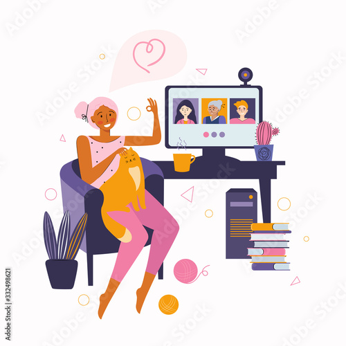 Woman communicates with friends and relatives through online video communication. Spending time at home. Desktop computer with group of people taking part in video conference. Video call to friends.