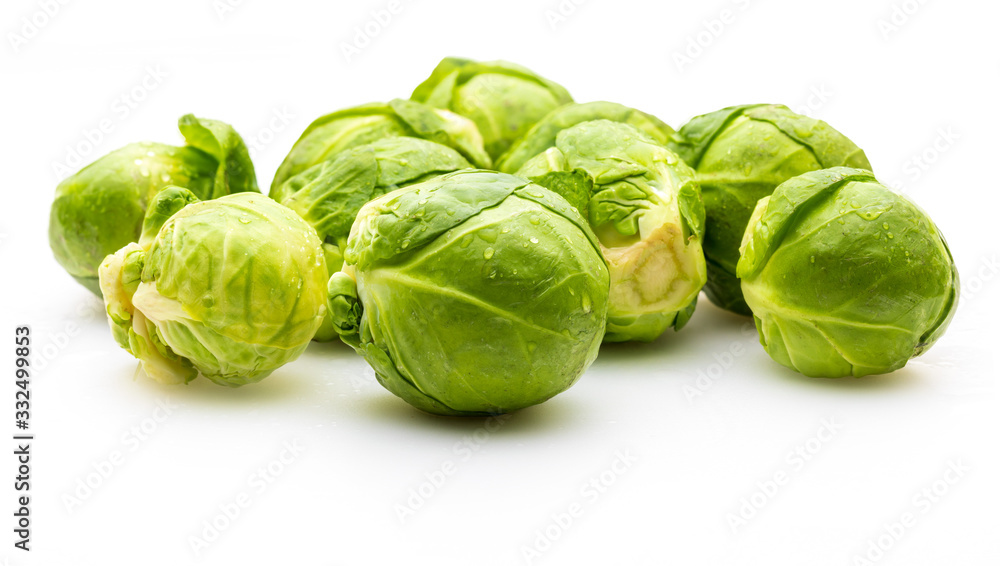 Close-up of raw, fresh and whole brussels sprouts (cabbages - Brassica oleracea). Isolated on white background. Close-up of raw, fresh and whole brussels sprouts (cabbages - Brassica oleracea). Isolated on white background.