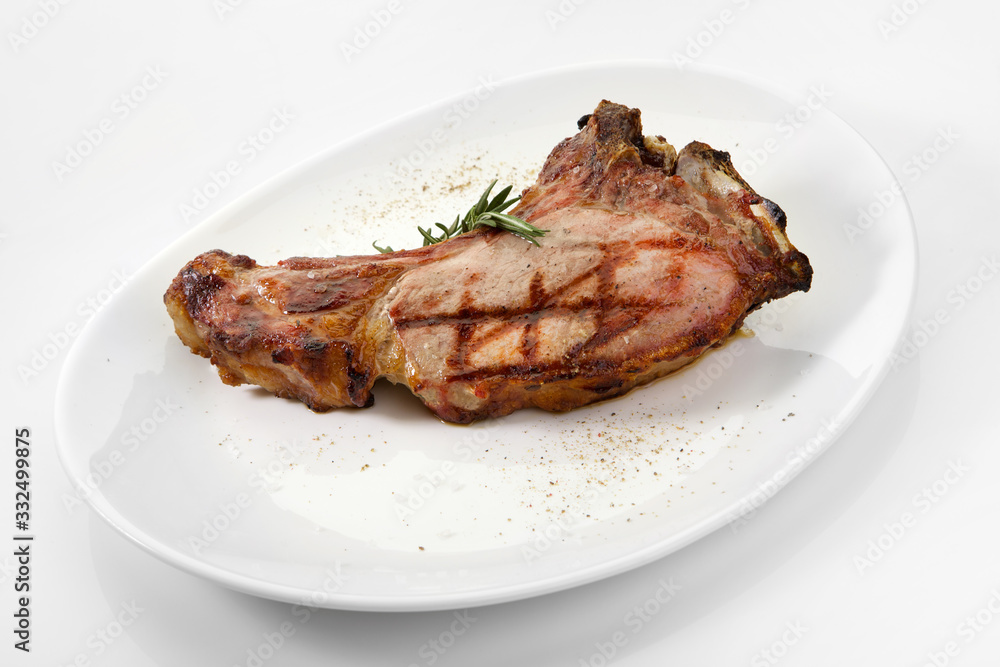Appetizing grilled rib isolated on white background. Grilled mutton rib with blood Appetizing grilled rib isolated on white background. Grilled mutton rib with blood